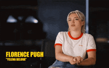 a woman sitting in a chair with the name florence pugh above her