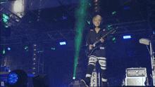 a person playing a guitar with hba written on their pants