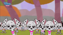 a group of dalmatian dogs standing next to each other with the words disney channel premiere on the bottom right