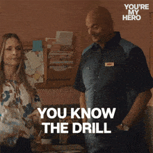 a man and a woman standing next to each other with the words you know the drill
