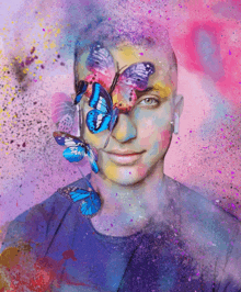 a man with blue butterflies on his face