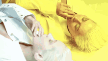 a blurred image of a person 's face and a yellow background