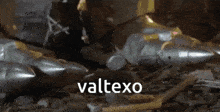 a bunch of missiles are laying on the ground and the word valtexo is on the bottom left