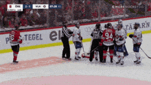 a hockey game is being played with a score of 2-1