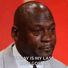 a man in a suit and tie is crying with tears running down his face .