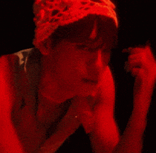 a person in a red hat is looking down