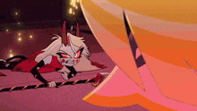 a cartoon character with horns is laying on the floor next to another character .