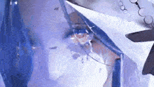 a close up of a woman 's face with blue hair