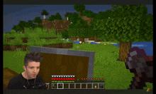 a man is playing a video game with a cross in the middle