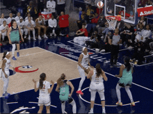 a basketball game is being played on a court with a state farm logo on it