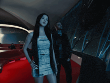 a man and a woman are standing next to each other