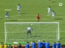 a soccer game is being played on a field with a star in the middle