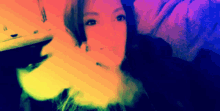 a woman is smoking a cigarette with a rainbow background