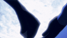 a person holding another person 's hand in a dark room