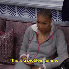 a woman is sitting on a couch with the words that 's a problem for me