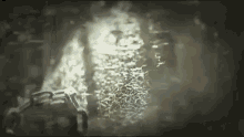 a close up of a chain in the dark with a light coming out of it .