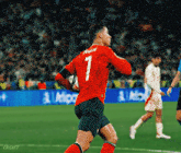 a soccer player wearing a red jersey with the number 1 on it