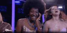 a group of women are laughing in a star academy video