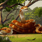 a cartoon snake is laying down in the grass and smiling