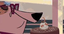 a cartoon of a dog smelling a cake with disney premiere written on the bottom right