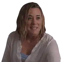 a woman with wet hair wearing a white shirt and a necklace