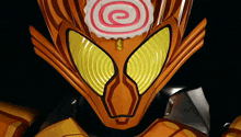 a close up of a cartoon character 's face with a spiral on it