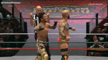 two wrestlers in a ring with the words grand slam mexico on the screen