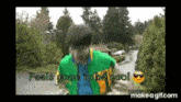 a man in a green jacket with the words feels good to be cool on the bottom
