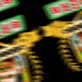 a blurry image of a green and yellow sign that says ' coca cola '