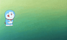 a cartoon character named doraemon is standing in the grass