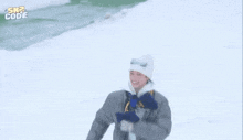a person is playing in the snow with the words " sn2 code " in the upper right corner