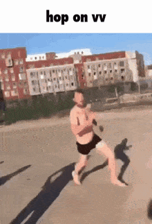 a man without a shirt is running on a beach with the words hop on vv above him