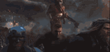 a group of avengers are flying through the air in a battle .