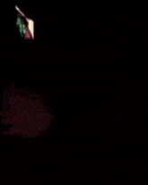 a blurry picture of a man dancing in front of a blue wall
