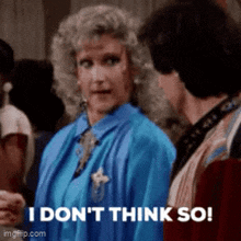 a woman in a blue shirt is saying i don 't think so