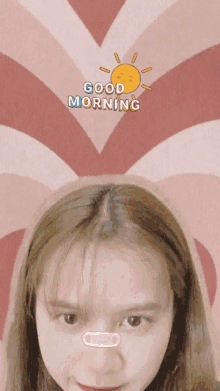 a girl with a bandage on her nose and the words good morning