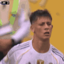 a close up of a soccer player 's face with the word juv on the bottom