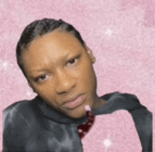 a woman is making a funny face while wearing a black shirt and tie .