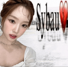 a woman is standing in front of a sybeau logo