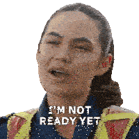 a woman says i 'm not ready yet while wearing a safety vest