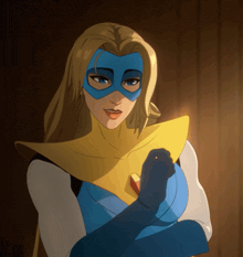 a woman in a superhero costume with a blue mask