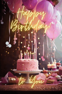 a pink birthday cake with candles and balloons with the words happy birthday to you written in neon