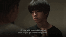 a man 's face is being held by another man with the words i 'll hire a hit man