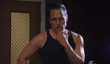 a man in a black tank top with the words i 'm stronger and i 'm gonna win behind him