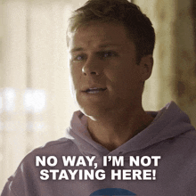 a man wearing a purple hoodie says no way i 'm not staying here