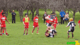 a group of young boys are playing a game of rugby and one of them has the number 6 on his shirt