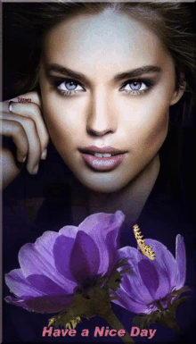 a picture of a woman with purple flowers and the words have a nice day on the bottom