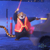 a poster for zootopia 2 shows a cheetah holding a traffic light
