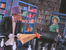 a man in a top hat is holding an umbrella in front of a woman