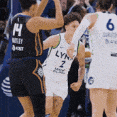 player number 2 for the lynx basketball team is getting a high five